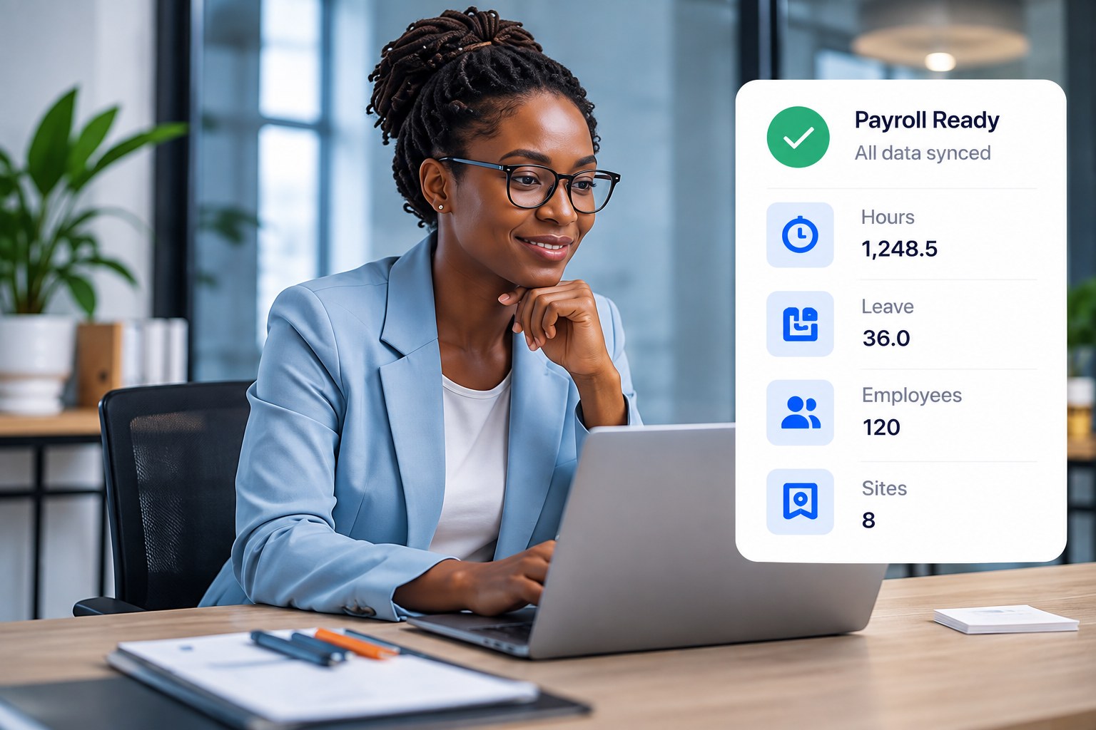 A payroll manager at her laptop, with the TravailOS payroll-ready card showing hours, leave, employees and sites